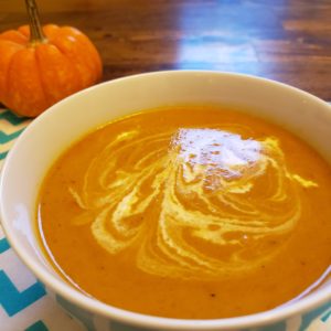 Butternut Squash Soup on Chevron placemat with pumpkins in background