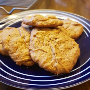 Light peanut butter cookies on a blue plate