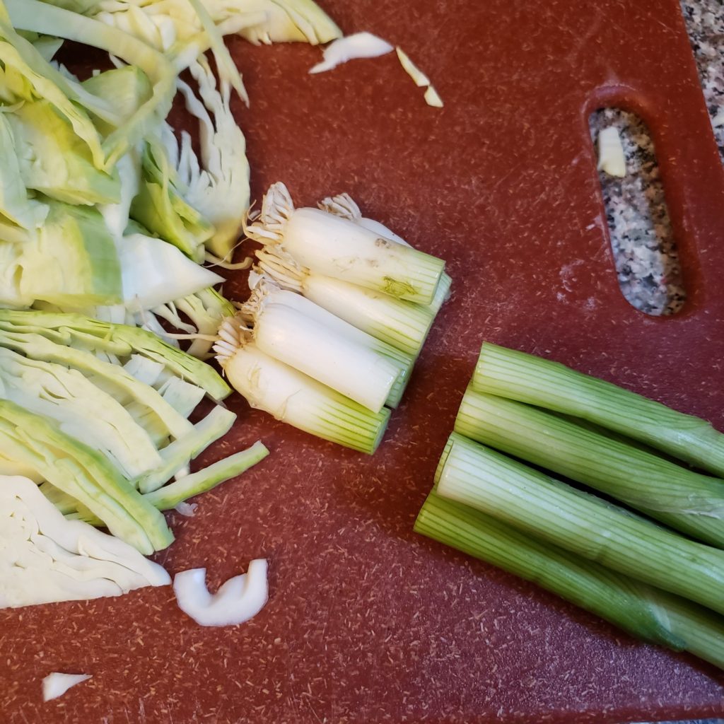 Cut green onions and cabbage for Colcannon