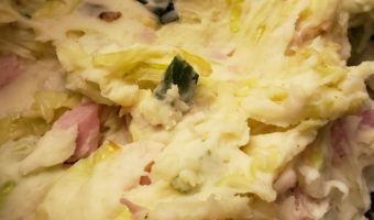 Mashed potatoes with bits of ham, onion, and cooked cabbage