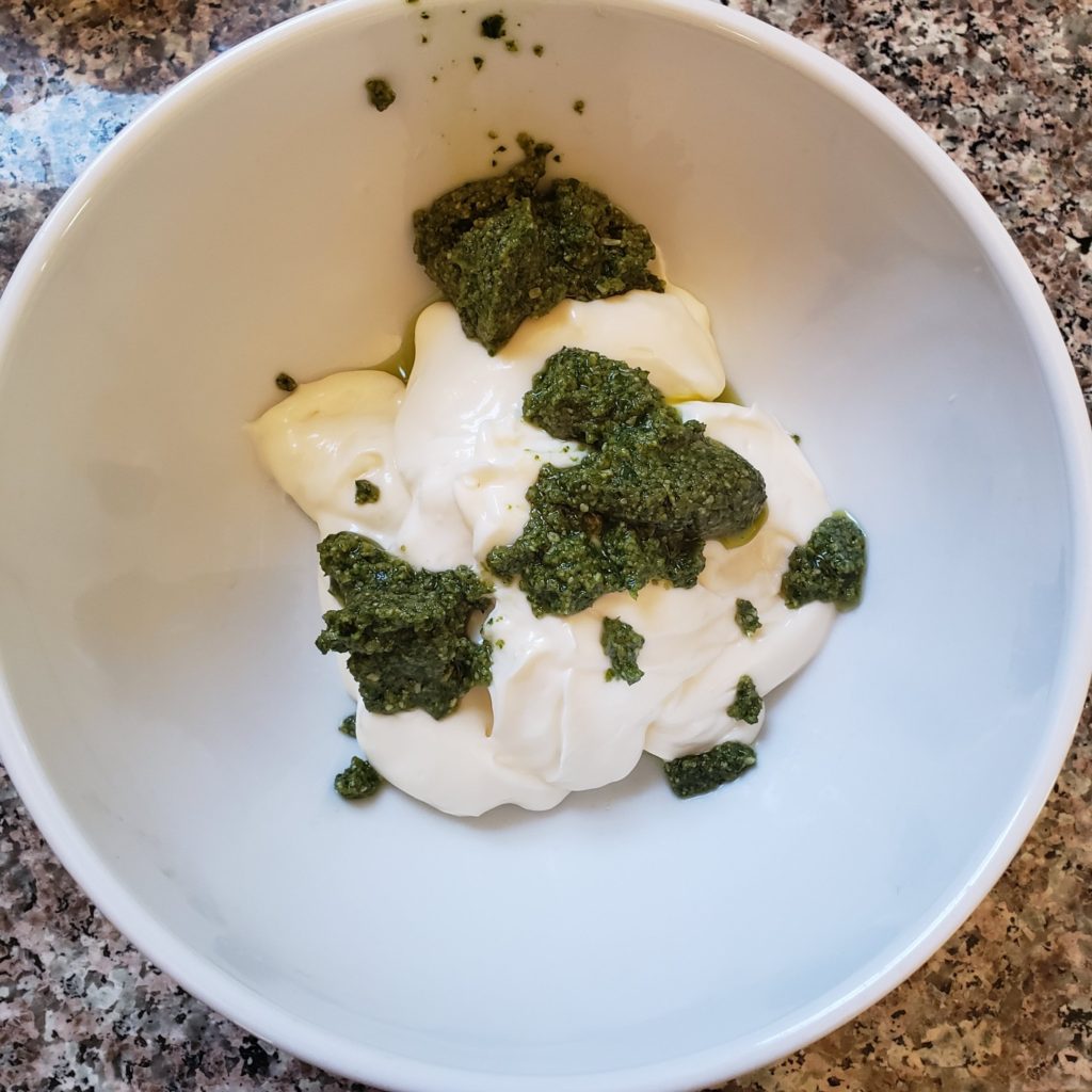 Mayo and pesto in a bowl for pesto aioli
