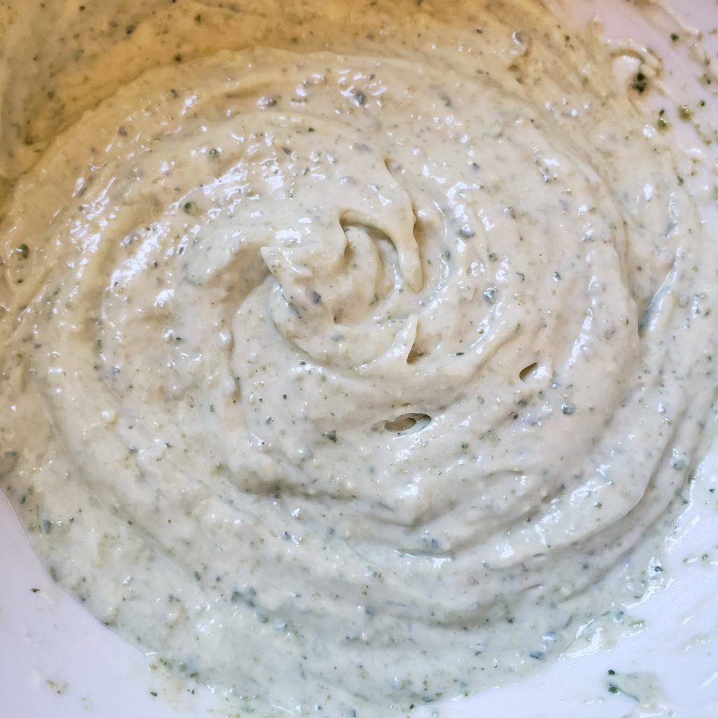 Finished pesto aioli in a bowl