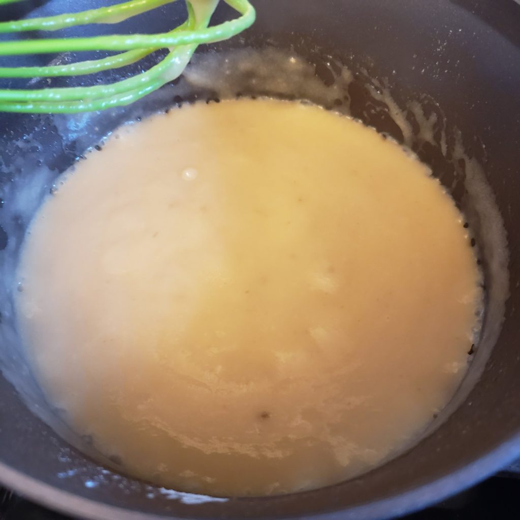 whisking the bechamel while thickening