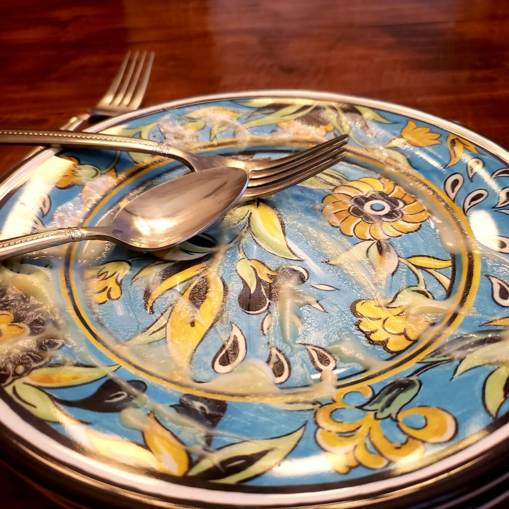 blue and yellow plate where a banana cream pie was eaten