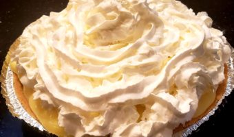 banana cream pie topped with whipped cream