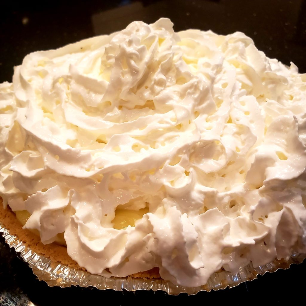 banana cream pie covered in whip cream