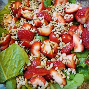Strawberries, tomatoes, nuts, and lettuce