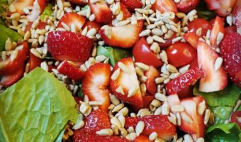 Strawberries, tomatoes, nuts, and lettuce